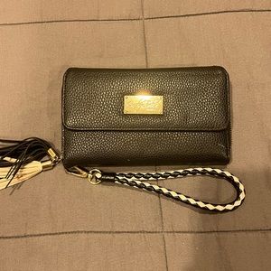 Carolyn Tucker black wristlet with tassels on the zipper